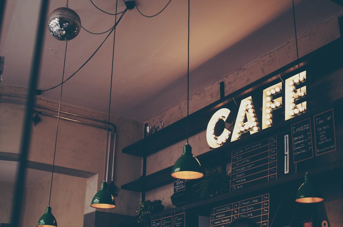 The welcoming counter and café sign of a local business