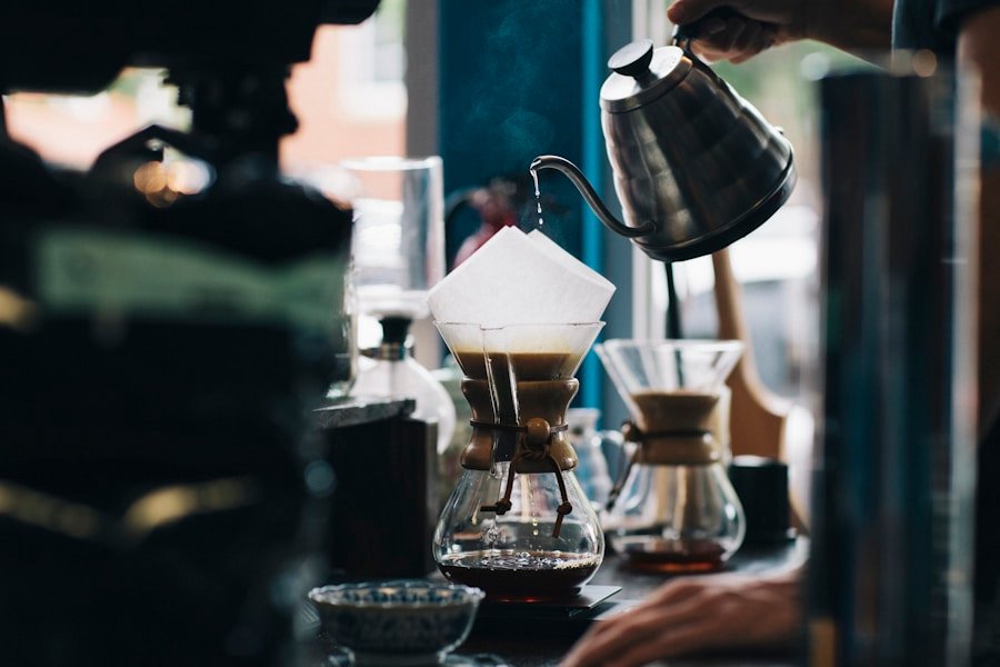 A barista pouring water into a coffee filter